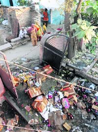 After two days a fire broke out in a crackers godown in Sriram Colony, Karnal, firecrackers still lie at the site on Wednesday, posing a threat to residents of the colony