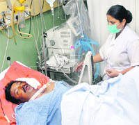 Sub-Inspector Chandan Das, who was shot at, undergoing treatment at the Sacred Heart Hospital in Jalandhar on Wednesday. 