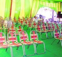 Chairs lie unoccupied at the auction of a commercial site on Ladowall Road by PUDA in Jalandhar on Wednesday.