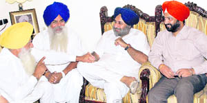 Deputy Chief Minister Sukhbir Badal interacts with party leaders at the house of Parupkar Singh Ghuman, former president of the District Bar Association, in Ludhiana on Tuesday. 