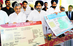 Punjab Deputy Chief Minister Sukhbir Singh Badal launches a smart vehicle registration card in Zirakpur on Wednesday. 