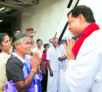 Minister of Economic Development Basil Rajapaksa welcomes refugees from India in Colombo on Wednesday