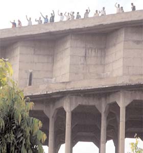 The Farad Kendra protesters atop the water tank near the Rose Garden in Bathinda on Thursday