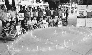 Members of the Optometrists Association observe World Sight Day by lighting candles in the shape of an eye at Sector 17