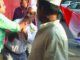 A TV grab of the clash between supporters of Anna Hazare and members of the Bhagat Singh Kranti Sena outside the Patiala House in New Delhi on Thursday.