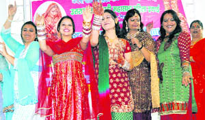 Women participate in a competition organised by the Uttarakhand Punjabi Mahasabha in Dehradun on Thursday. 
