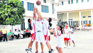 A match under way during the District Youth Girls/Boys Basketball Tournament at Doon International School in Dehradun on Thursday. 