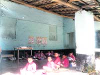 Students attend classes in a verandah of Government Primary School, Pathiar, near Dharamsala.