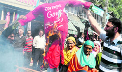 Activists of the womens wing of the PDP burn an effigy of the state government during a protest in Srinagar on Thursday