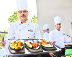 Chef Ashish Bali with platters
