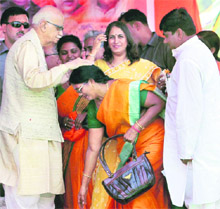 BJP leader LK Advani blesses a member of the party at a public meeting during his Jan Chetna Yatra in Varanasi on Thursday