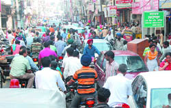 With the festival season on, the number of visitors to the citys main market, Dhobi Bazaar, has risen resulting in traffic congestion on the 200 metre odd stretch. Four-wheelers also add to the traffic woes causing difficulties even for those on foot.