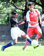 Players of St Annes School and Saupins School vie for the ball during a match of the of the Chandigarh Sub-Junior Football (Boys) Championship at Sector 17 of Chandigarh on Friday. 
