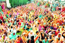 Anganwari workers hold a protest in front of the Secretariat in Dehradun on Friday.