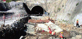 Workers at the Banihal side of the Pir Panjal tunnel. The drilling work of the tunnel was completed on Friday.