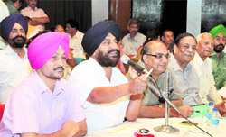Chairman of the Jalandhar Improvement Trust Baljit Singh Neelamahal chairs the auction of commercial sites in Jalandhar on Friday