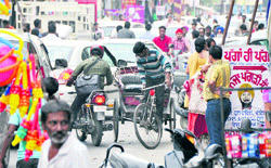 A rickshaw puller making his way through heavy traffic on the eve of Karva Chauth in Ludhiana