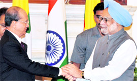 Prime Minister Manmohan Singh shakes hands with Myanmar President U Thein Sein after the signing of agreements in New Delhi on Friday.