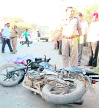 A police officer inspects the spot where a CID constable was crushed to death near Gheomandi Chowk in Amritsar on Saturday