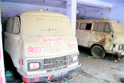 Defunct ambulances of the ESI Hospital parked under a shed on the hospital premises in Amritsar on Saturday