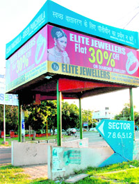 Advertisements displayed on a PCR van shelter in Panchkula