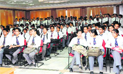 Students of Graphic Era University await their turn at a placement drive in Dehradun on Saturday