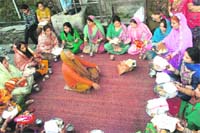 Women during the thali puja on the occasion of Karva Chauth in Shimla@@on Saturday.