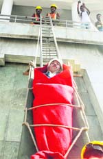 Fire fighters perform a mock drill at the Ridge in Shimla