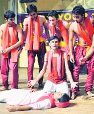 Artistes perform a skit during the display your talent competition in the University of Jammu on Saturday.
