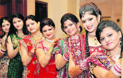 Women participate in a fashion show on Karva Chauth in Jalandhar on Saturday