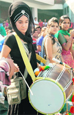 Another student beats a dhol during the youth festival held on the campus in Phagwara on Saturday