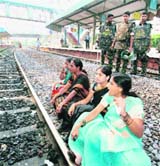Pro-Telangana women activists sit along a railway track at the Secunderabad railway station on Day 1 of their three-day rail roko in Hyderabad on Saturday. 