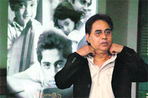 The singer in front of a portrait of his late son Vivek Singh in Chandigarh 