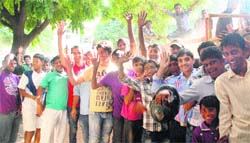 Cricket fans wait for tickets outside the PCA Stadium in Mohali on Sunday. 