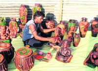 An artisan with his products at Crafts Bazar at the Parade Ground in Dehradun.