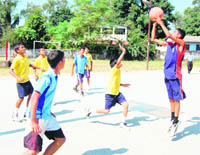 Players in action in a match in the District-Level Basketball Tournament in Dehradun  on Sunday. 