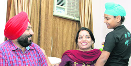Leather goods manufacturer Raju Virk with his family at their house in Jalandhar. 