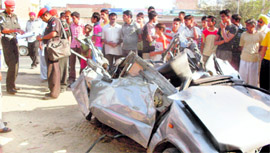 The mangled remains of the car after it collided with an Army truck in Jalandhar on Sunday.