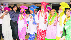 Parminder Singh (pink turban), Maj (retd) Rashpal Singh (red turban) along with Preetam Kaur (in green dupatta) dance to the tunes of Punjabi folk songs at a function organised at a private hospital in Mohali.