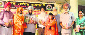 Dr Gurnek Singh, Vice-Chancellor of Sri Guru Granth Sahib World University (fourth from left), releases the book Karamyogi Sant Balbir Singh Ji Seechewal in Ludhiana on Sunday.