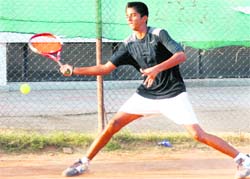A player returns a shot during the Manav Mangal Total Tennis Tournament at Phase X, Mohali, on Monday.