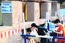 Visitors queue before the ticket counter during the National Crafts Mela at Kalagram in Chandigarh on Monday. 