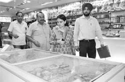 Panchkula SDM Shradeep Kaur Brar with officials during an inspection at a sweetmeat shop at Sector 8, Panchkula, on Monday.