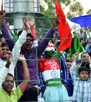 Cricket fans celebrate Indias victory against England at the Ferozeshah Kotla ground in New Delhi on Monday.