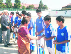 Guests meet players on the occasion of the All-India Inter-school Hockey Tournament in Mussoorie on Monday. 