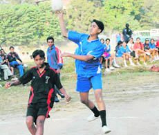 A match under way in the District Handball Tournament in Dehradun on Monday.