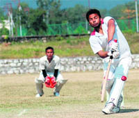 A player in action in a match in the UTU Inter-college Cricket Tournament in Dehradun 