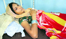 Badly bruised Monu lying on the bed at the Ratia Community Health Centre in Fatehabad on Monday.
