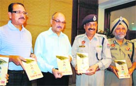 Anil Kaushik, DGP, Punjab ( second from left), releases a book authored by S.P. Joshi, ADCP, in Amritsar