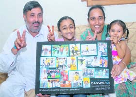 Harwinder Singh, son of Fauja Singh, with his family in a jubilant mood at their ancentral house in Beas Pind in Jalandhar on Sunday